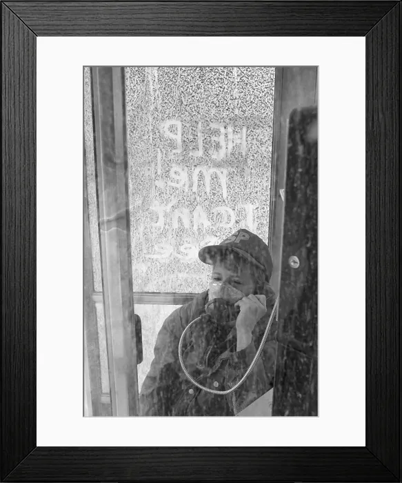 Framed Print : Child Makes Phone Call With Air Mask