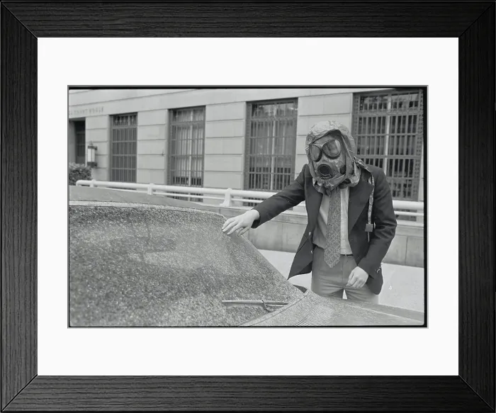 Framed Print : Man with Gas Mask Examining Car Framed Print : Man with Gas Mask Examining Car