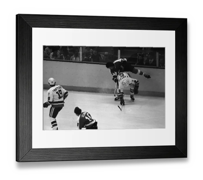 Framed Print : Denis Potvin Knocking Reggie Leach Off His Feet