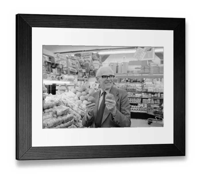 Framed Print : Physician Denis Burkitt Holding Fruit in Supermarket Framed Print : Physician Denis Burkitt Holding Fruit in Supermarket
