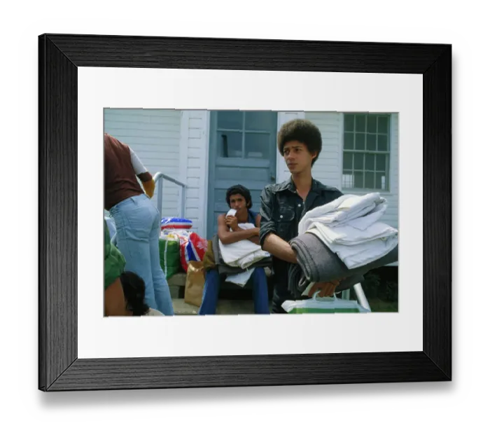Framed Print : Young Man Carrying Bedding Framed Print : Young Man Carrying Bedding
