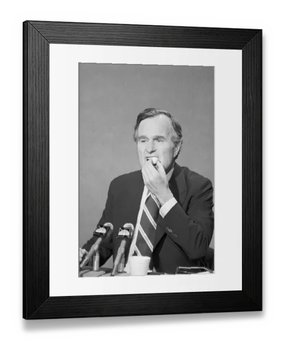 Framed Print : George Bush Eating a Doughnut Framed Print : George Bush Eating a Doughnut