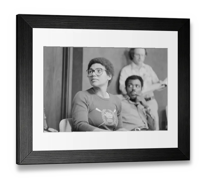 Framed Print : Anita DeFranz Sitting and Wearing Eyeglasses Framed Print : Anita DeFranz Sitting and Wearing Eyeglasses