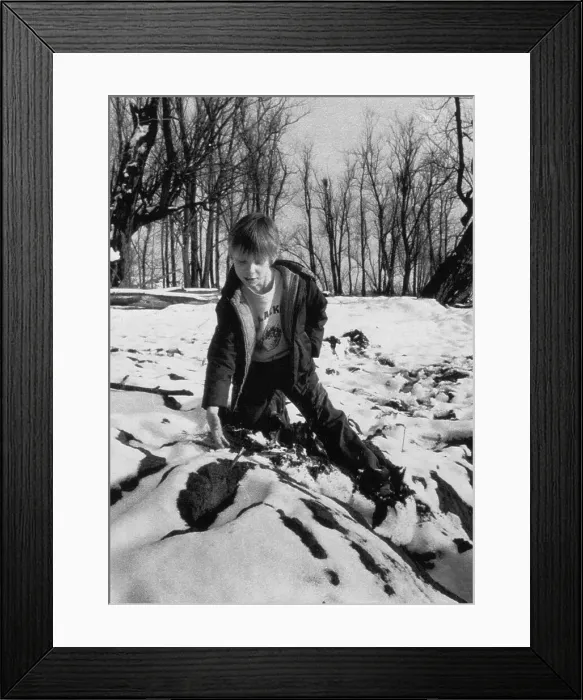 Framed Print : Boy Pointing out Mound in the Snow Framed Print : Boy Pointing out Mound in the Snow