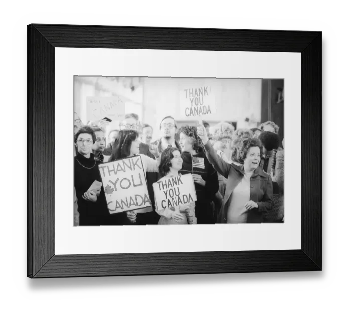 Framed Print : Foreign service employees hold signs thanking Canada after their covert rescue of six American diplomats from Tehran Framed Print : Foreign service employees hold signs thanking Canada after their covert rescue of six American diplomats from Tehran
