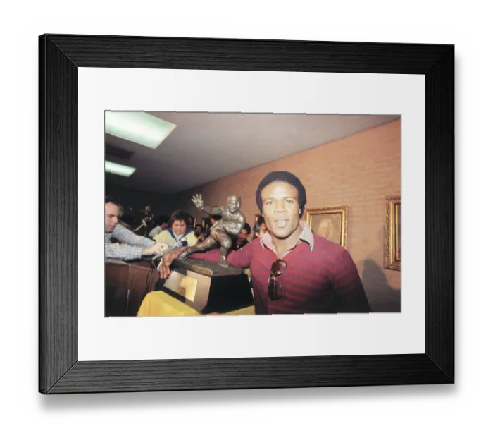Framed Print : Charles White Posing with Heisman Trophy
