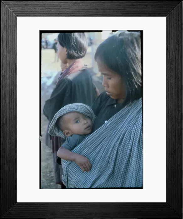 Framed Print : Boy Sitting in Refugee Camp Framed Print : Boy Sitting in Refugee Camp