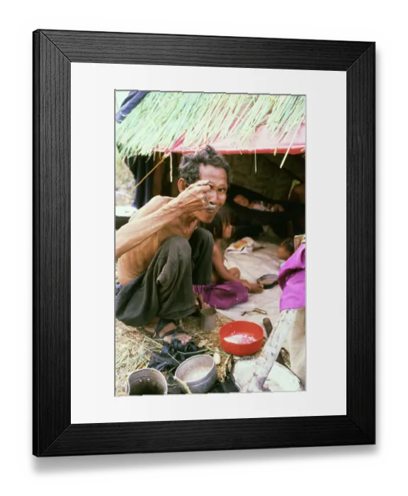 Framed Print : Cambodian Refugee Eating Framed Print : Cambodian Refugee Eating