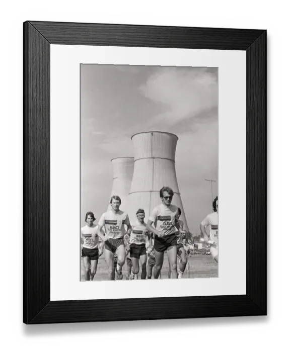 Framed Print : Nuclear Workers Running In Front / Towers
