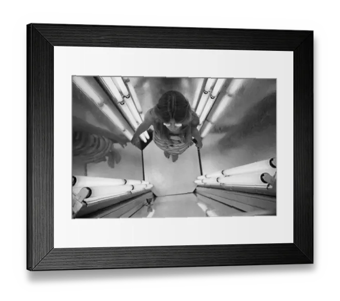 Framed Print : Woman In Tanning Salon Booth Framed Print : Woman In Tanning Salon Booth