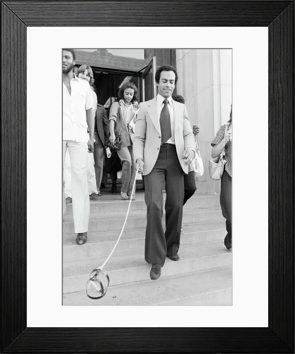 Framed Print : Huey Newton Holding Floating Dog Harness