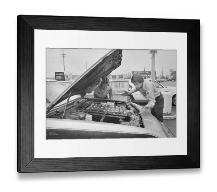 Framed Print : Gas Station Attendants Looking Under Hood of Electric Car Framed Print : Gas Station Attendants Looking Under Hood of Electric Car