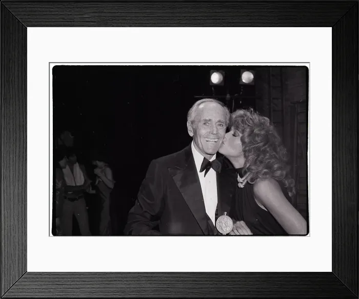 Framed Print : Jane Fonda Kissing Henry Fonda on Cheek