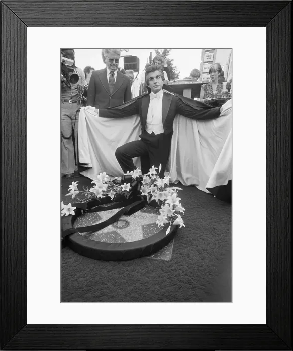 Framed Print : Actor George Hamilton Places Wreath on Bela Lugosi's Star Framed Print : Actor George Hamilton Places Wreath on Bela Lugosi's Star
