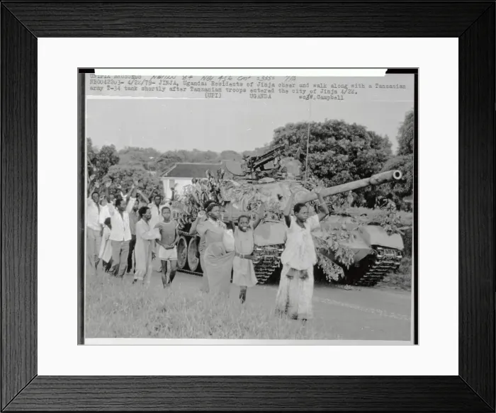 Framed Print : Ugandans Walking Along Army Tank Framed Print : Ugandans Walking Along Army Tank