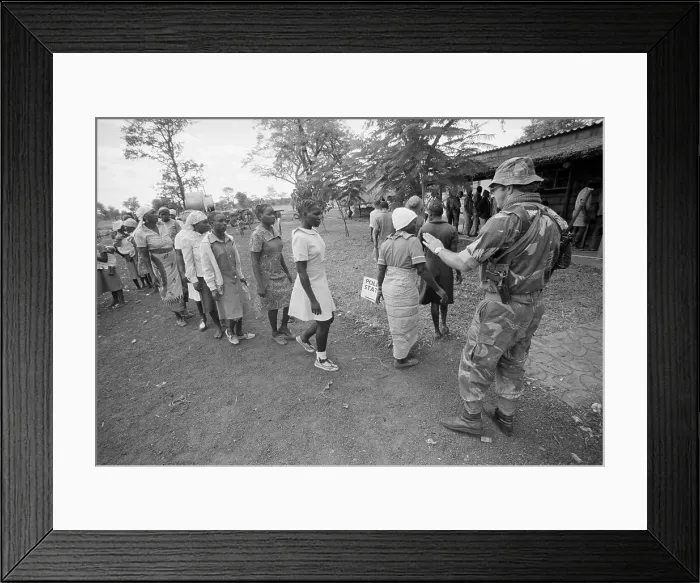 Framed Print : Soldier Observing Voters Framed Print : Soldier Observing Voters