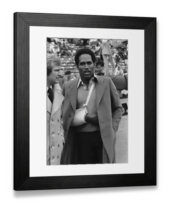 Framed Print : Injured O.J. Simpson Watches the Game from the Sidelines Framed Print : Injured O.J. Simpson Watches the Game from the Sidelines