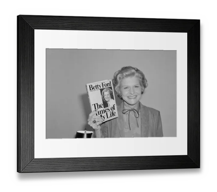 Framed Print : Betty Ford Holding up Her Book Framed Print : Betty Ford Holding up Her Book