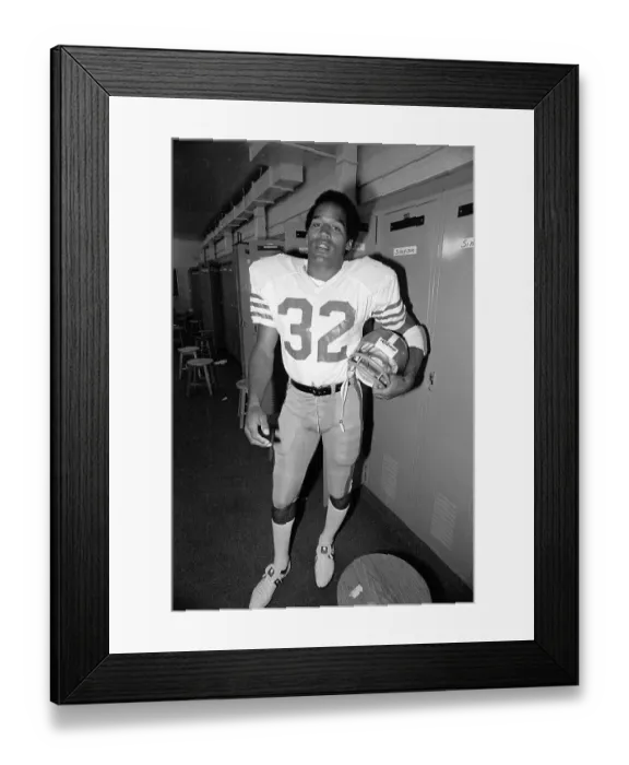 Framed Print : O.J. Simpson Tries on His 49'ers Uniform for the First Time Framed Print : O.J. Simpson Tries on His 49'ers Uniform for the First Time
