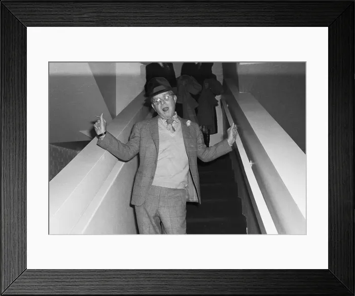 Framed Print : Capote On Stairs Waving / Waist Up 1978 Framed Print : Capote On Stairs Waving / Waist Up 1978