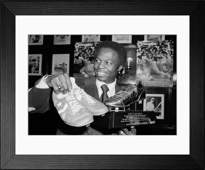 Framed Print : Lou Brock Holding Shoes And Shoe Trophy Framed Print : Lou Brock Holding Shoes And Shoe Trophy