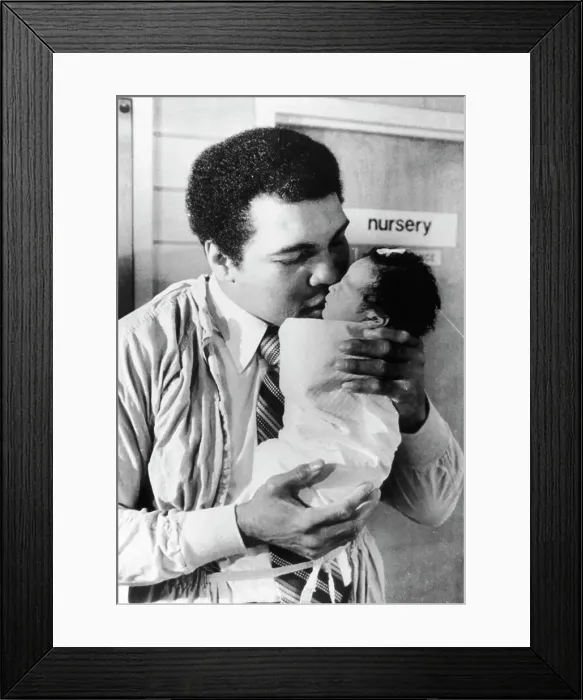 Framed Print : Muhammad Ali Kissing His Baby Daughter Framed Print : Muhammad Ali Kissing His Baby Daughter