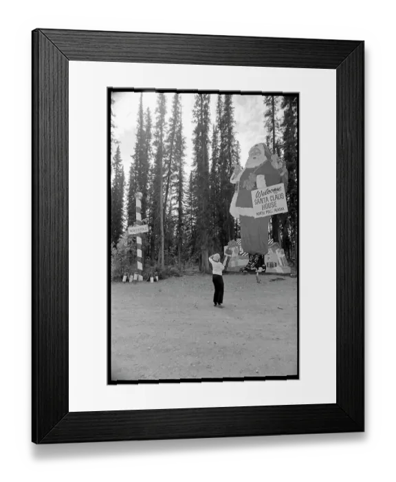 Framed Print : Woman Looking at Santa Claus House Framed Print : Woman Looking at Santa Claus House