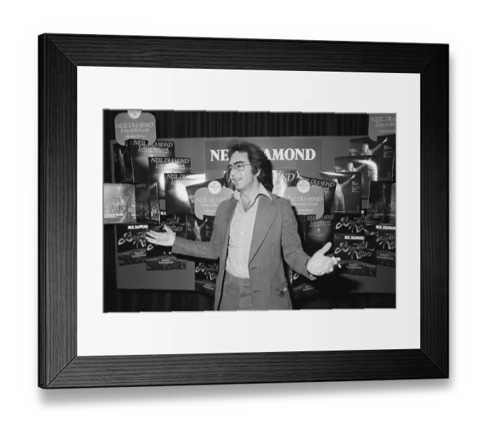 Framed Print : Neil Diamond in Front of Album Display Framed Print : Neil Diamond in Front of Album Display