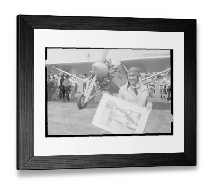 Framed Print : Paul Poberenzy Holding Photograph of Charles A. Lindbergh Framed Print : Paul Poberenzy Holding Photograph of Charles A. Lindbergh