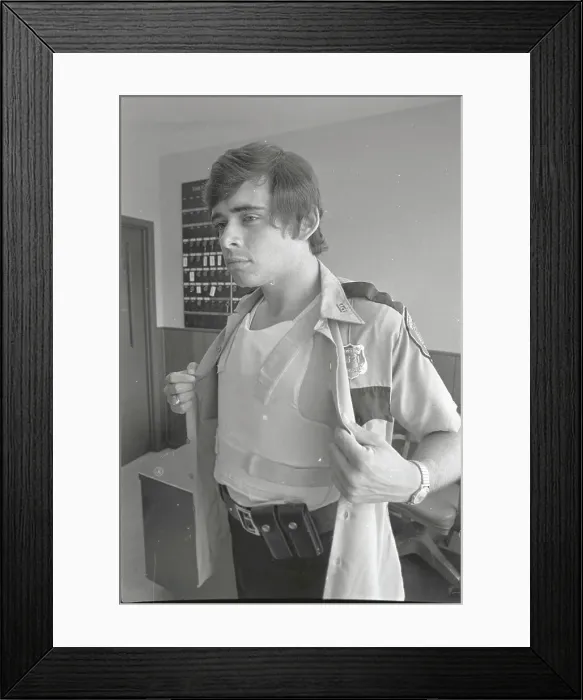 Framed Print : Police Bearing Bullet Proof Vest Framed Print : Police Bearing Bullet Proof Vest