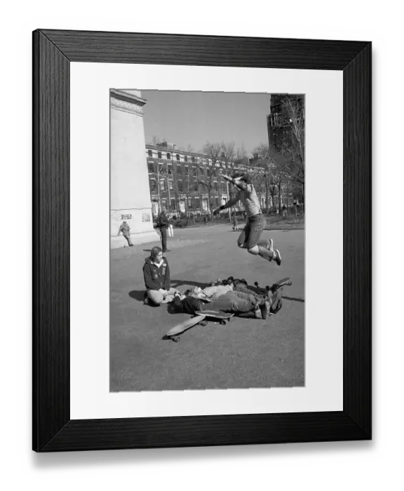 Framed Print : Skateboarder Jumping over People onto Skateboard Framed Print : Skateboarder Jumping over People onto Skateboard