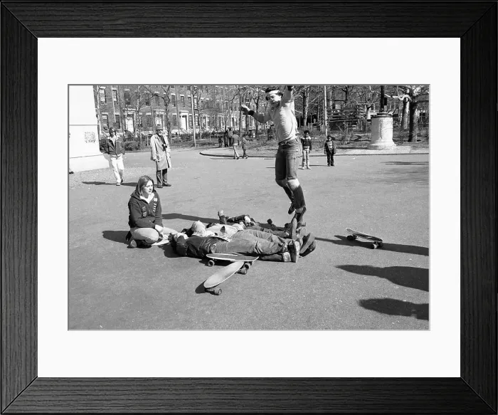 Framed Print : Boy Attempting Jump over Bodies onto Skateboard Framed Print : Boy Attempting Jump over Bodies onto Skateboard