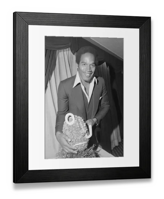 Framed Print : O.J. Simpson Poses With A Football Framed Print : O.J. Simpson Poses With A Football