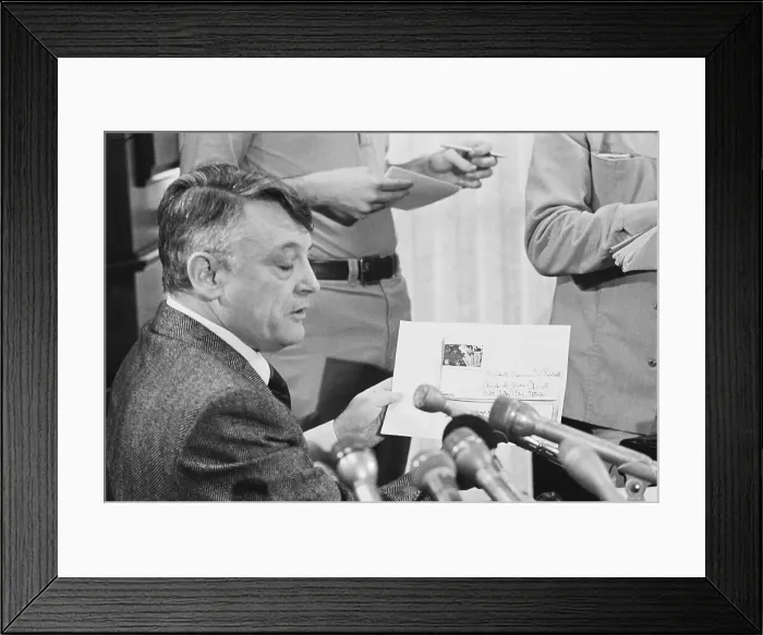 Framed Print : Harold Rhoden Holding up Document and Speaking Framed Print : Harold Rhoden Holding up Document and Speaking