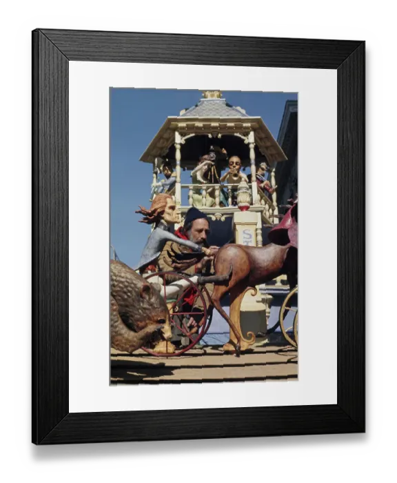 Framed Print : Sculptor With Wooden Figures Framed Print : Sculptor With Wooden Figures