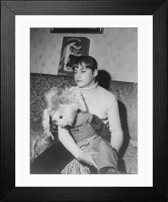 Framed Print : Nadia Comaneci Sitting and Holding a Stuffed Animal Framed Print : Nadia Comaneci Sitting and Holding a Stuffed Animal