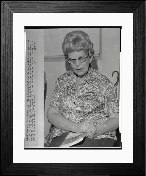 Framed Print : Blonde Fowler Sitting with Booklet in her Lap