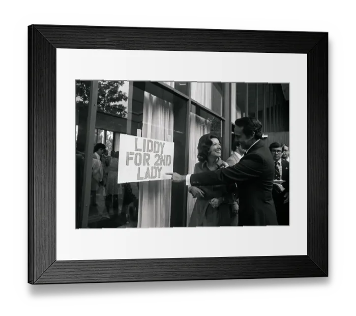 Framed Print : Bob and Elizabeth Dole Looking at Sign