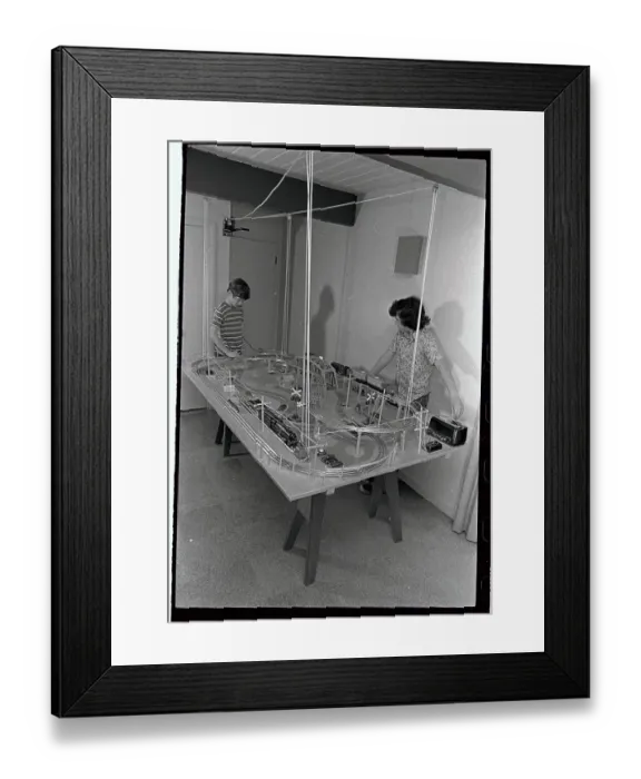 Framed Print : Boys Playing with Suspended Train Set Framed Print : Boys Playing with Suspended Train Set