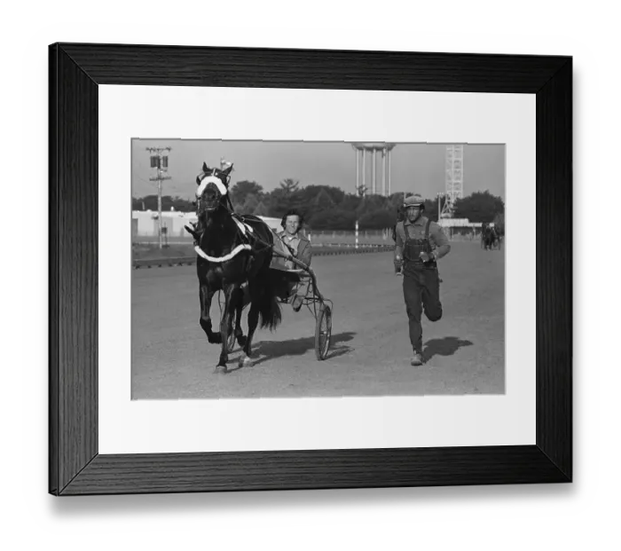 Framed Print : George Foreman Running Alongside Horse Framed Print : George Foreman Running Alongside Horse