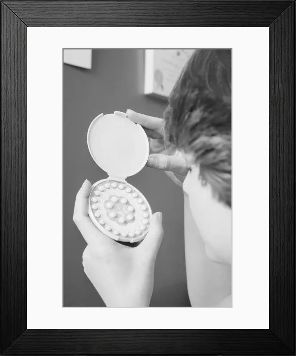 Framed Print : Woman Holding Case of Contraceptive Birth Control Pills Framed Print : Woman Holding Case of Contraceptive Birth Control Pills