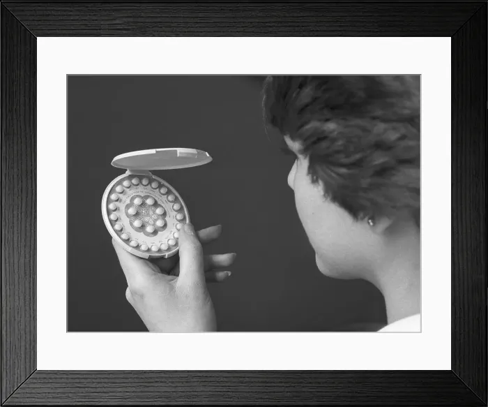Framed Print : Woman Holding Birth Control Pills Framed Print : Woman Holding Birth Control Pills