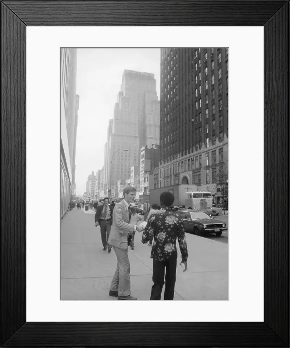 Framed Print : A Follower of Reverend Moon Handing Out Literature