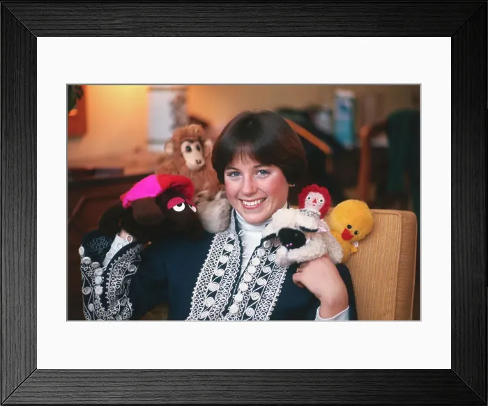 Framed Print : Dorothy Hamill Posing with Dolls Framed Print : Dorothy Hamill Posing with Dolls