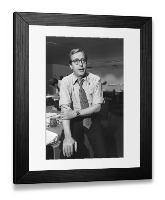 Framed Print : John Chancellor Sitting on Desk Framed Print : John Chancellor Sitting on Desk