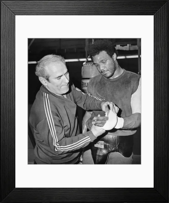 Framed Print : Coach Tapes George Foreman's Hand
