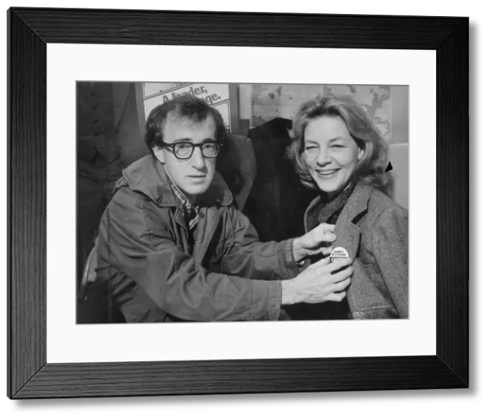Framed Print : Woody Allen Pinning a Button on Lauren Bacall Framed Print : Woody Allen Pinning a Button on Lauren Bacall