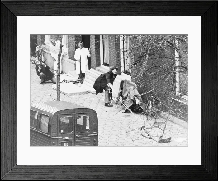 Framed Print : Person Dragging a Man to Safety Framed Print : Person Dragging a Man to Safety