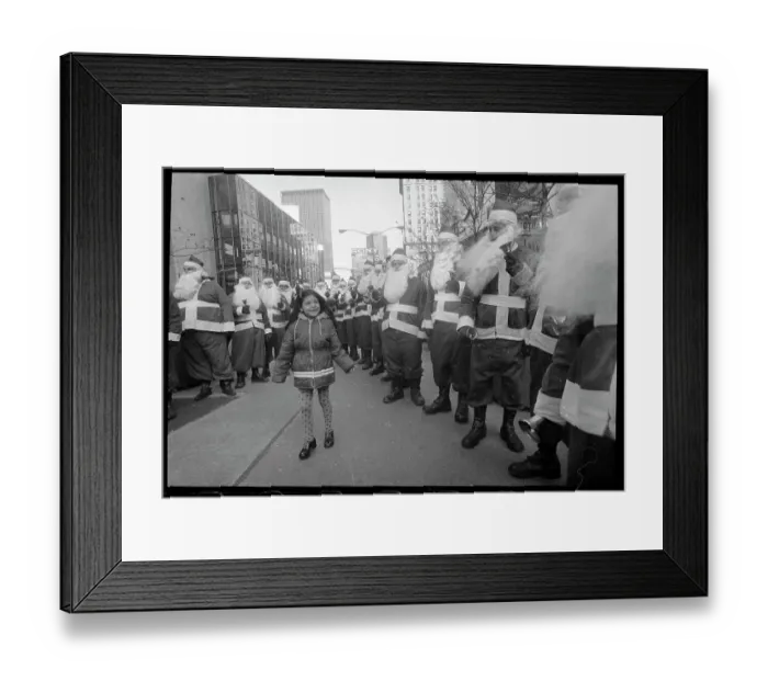 Framed Print : Girl Surrounded by Santa Clauses Framed Print : Girl Surrounded by Santa Clauses
