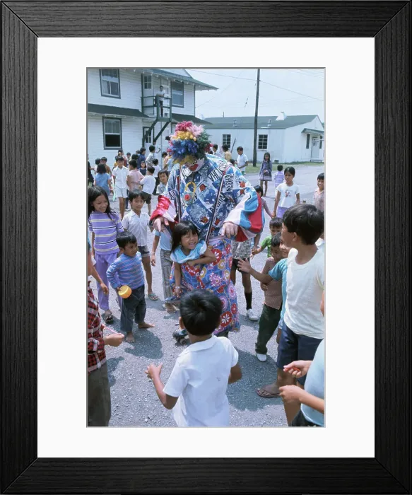 Framed Print : Clown Entertaining Children in Refugee Camp Framed Print : Clown Entertaining Children in Refugee Camp